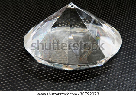 Big diamond gem at techno black background