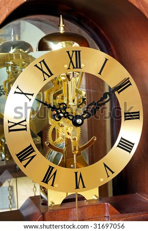Close up shot of analogue gold clock