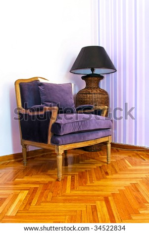 Reading room with vintage style purple armchair
