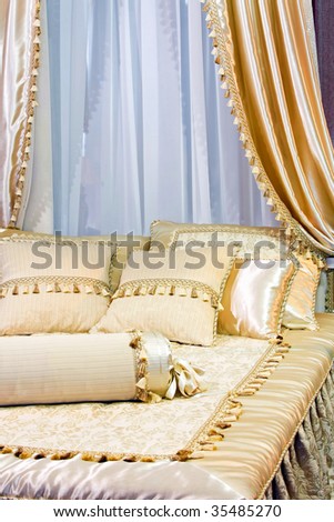 Silk beige bed with beautiful canopy decoration