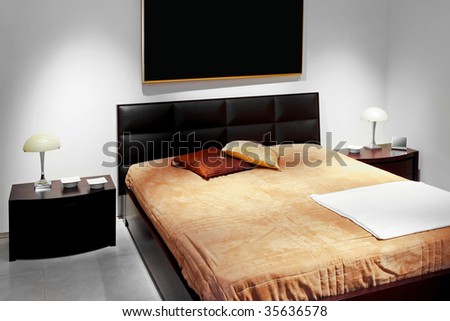 Double bed with leather pad and cotton sheets