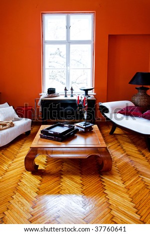 Orange living room with vintage style furniture