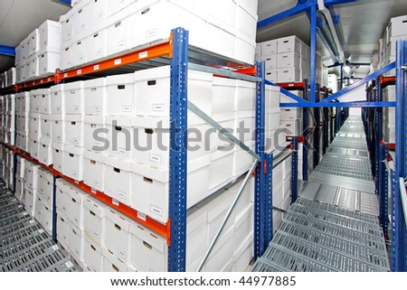 Corner shot of white boxes in warehouse