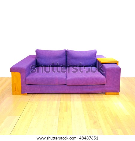 Big purple sofa in living room with hardwood floor