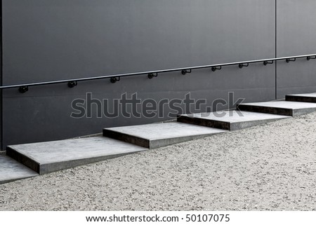 Rough industrial style concrete stairs outside the building
