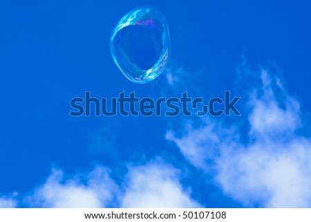 Big bubble made out of soap in sky