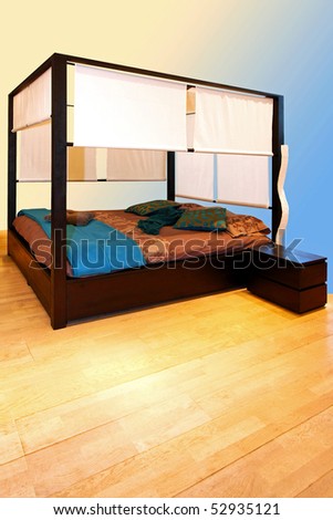 Bedroom in blue with big canopy bed