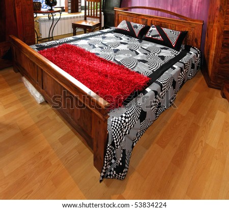 Retro double bed covered with cotton sheets