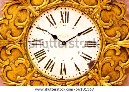 Detail of retro grunge decayed gold clock