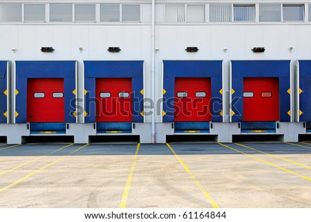 Many loading dock doors at big warehouse
