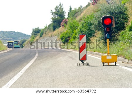 Red traffic light signal for road maintenance