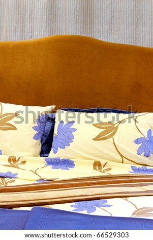 Cotton sheets with floral pattern design in bed