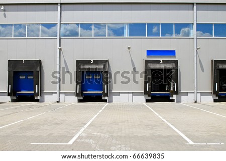Three cargo door ramp at warehouse building