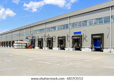 Cargo doors at big industrial warehouse building