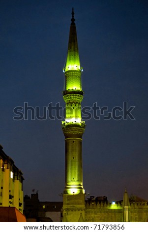 Mosque with green lights at night in Cairo