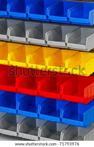 Colourful plastic open box container in warehouse