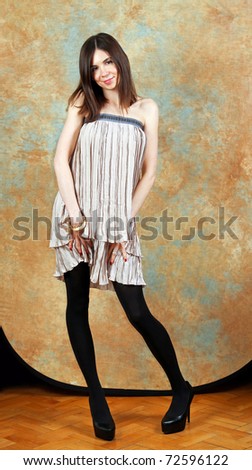 Very skinny brunette girl in gala dress