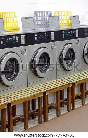 Coin operated washing machines in laundry shop