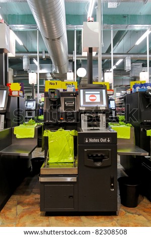 Modern self checkout machine in supermarket store