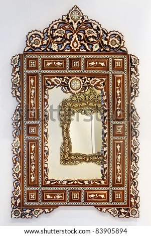 Antique Moroccan style mirror with decorative wooden frame