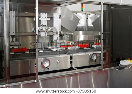 Packaging machine for packing ketchup in plastic bottles