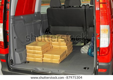 Bunch of boxes in mini van trunk