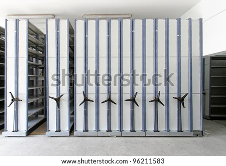 Automated shelving system with mobile cabinet for documents