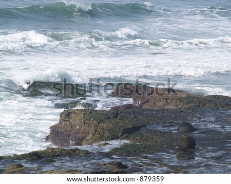 waves breaking on cliff