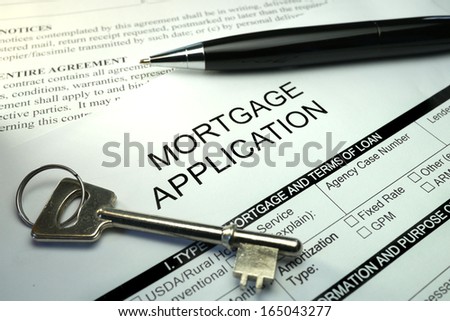 Pen And Key On Mortgage Application Form