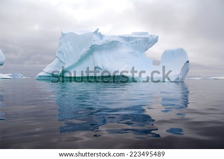 Iceberg reflection in calm ocean
