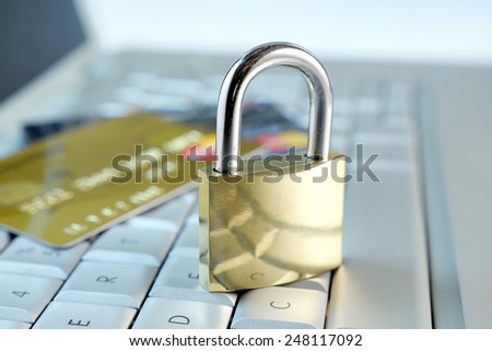 lock and credit card on keyboard