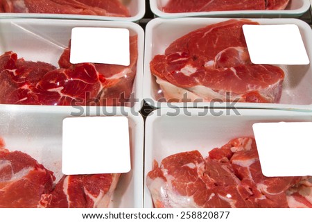 Variety of meat slices in boxes in supermarket