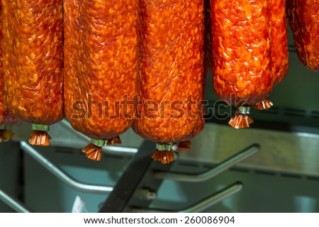 Uncooked smoked sausage on the counter in the store