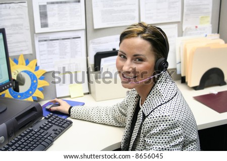 Beautiful female call center operator, headset customer service in a real situation not everyday isolation image