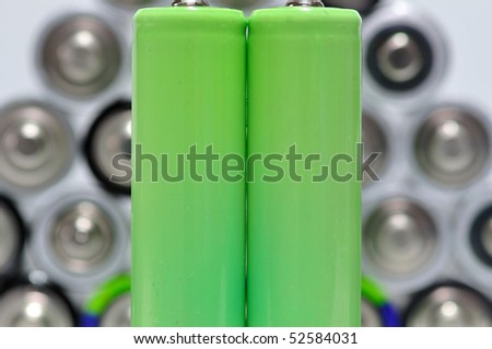 Two green Accu\'s in front of old Batteries (out of focus)