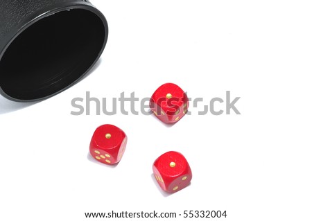 Three red dice showing one, in front of a dice cup; white background