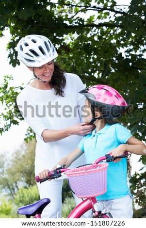 Mother And Daughter On Cycle Ride In Countryside