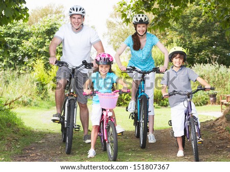 Family On Cycle Ride In Countryside