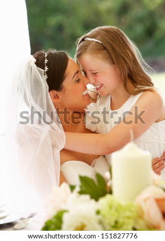 Bride With Bridesmaid In Marquee At Reception