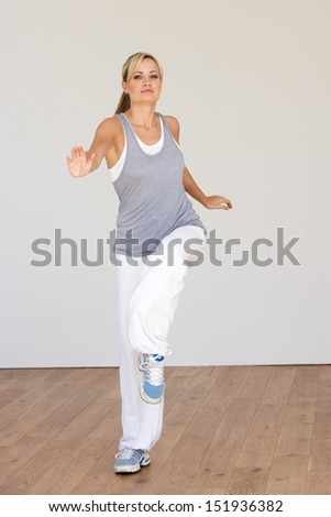 Woman Exercising In Dance Studio
