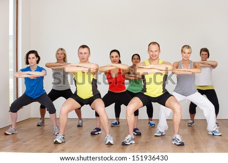 Group Of People Exercising In Dance Studio