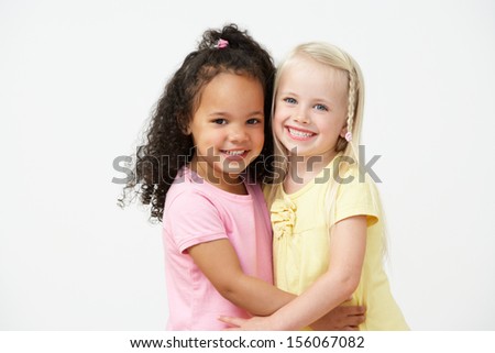 Two Pre School Girls Hugging One Another Two Pre School Girls Hugging One Another