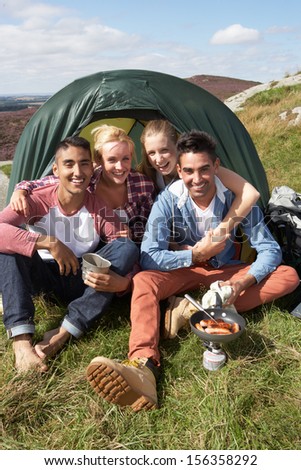 Group Of Young People On Camping Trip In Countryside