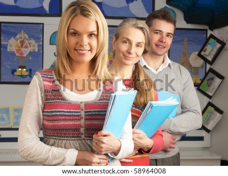 Portrait Of Group Of Teachers In Classroom