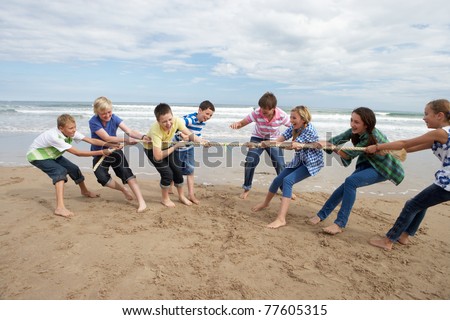 Teenagers playing tug of war