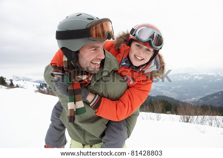 Young Father And Son On Winter Vacation