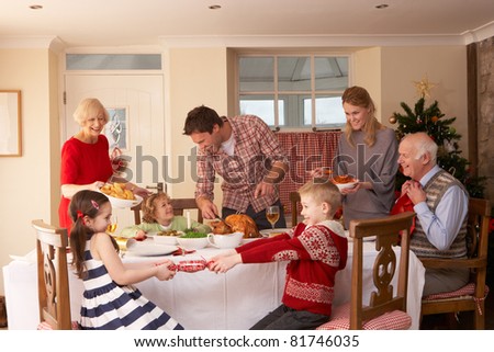 Family serving Christmas dinner Family serving Christmas dinner
