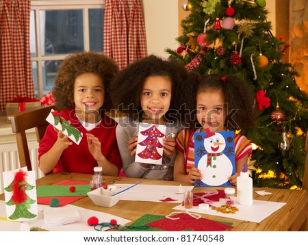 Mixed Race Children Making Christmas Cards Stock Photo 81740548