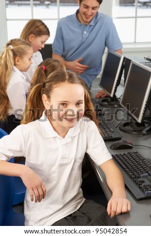 Girl in school class smiling to camera