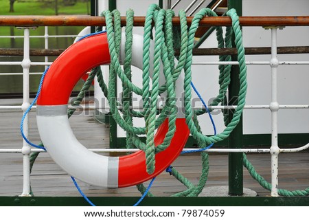 Illustration of on-board safety measures on ferry, ship or boat, with a life-buoy and ropes.
